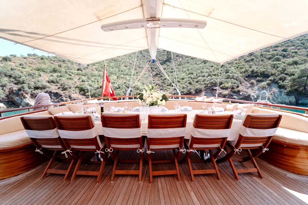 Outdoor dining and meals served on a gulet deck